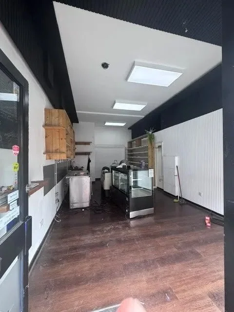 Before: an empty, narrow shop unit