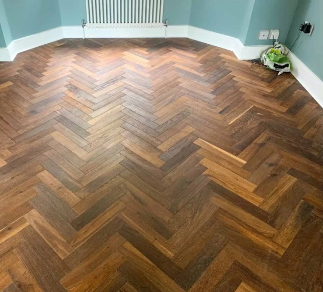 Dark herringbone parquet floor