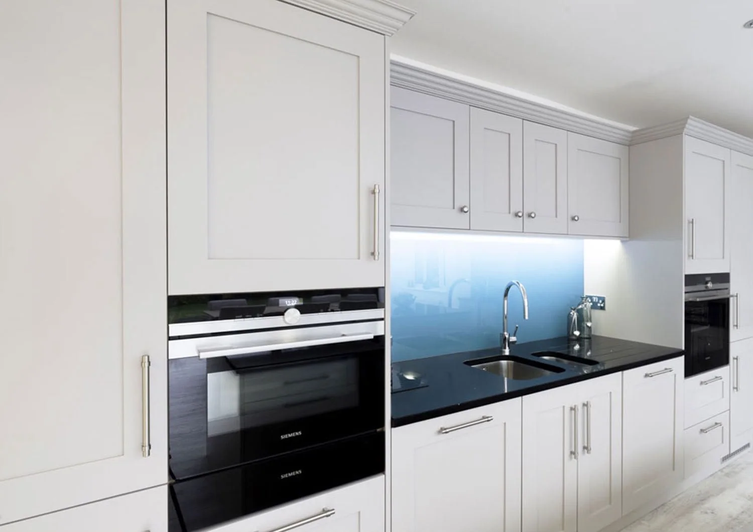 White shaker kitchen with integrated ovens