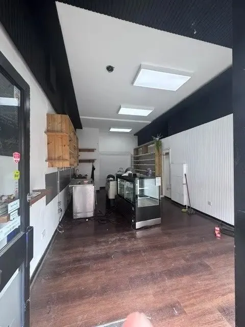 Before: an empty, narrow shop unit