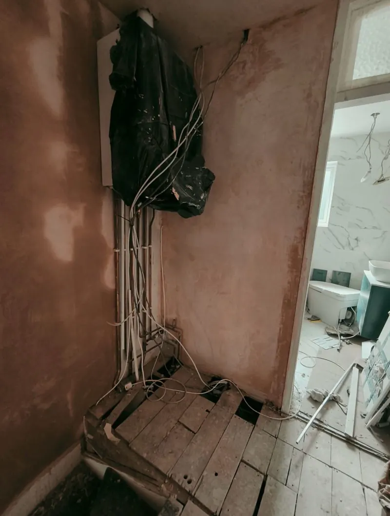 Before: exposed cables and an open corner on a landing